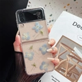 Detail of floral clear case for Samsung Z Flip6 featuring blue dried flowers and silver flakes - Matte Hard Shell Style - Blue Hydrangea / Samsung ZFold3