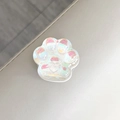 Vue macro d'un support téléphone patte de chat holographique avec détails irisés - Paillettes Laser Blanc