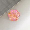 Close-up detailed view of a sparkling pink cat paw retractable phone socket grip accessory. - Colorful Sequins No. 12