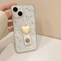 Detail of transparent iPhone case featuring silver foil, heart sequins, and leather ring strap - Off-white / iPhone 7/8/SE 2020
