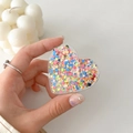 Close-up of heart-shaped acrylic phone grip with colorful glitter sequins and stars - Colorful Glitter Heart No. 5