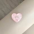 Nahaufnahme der rosa Herz-Handyhalterung mit silberner Schleife und Perlglanz-Effekt - Rosa Glitzer