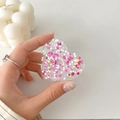 Detail of heart-shaped phone grip with pink star sequins and shimmering glitter filling - Colorful Glitter Heart No. 7