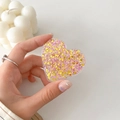Detail view of heart-shaped glitter phone grip with pink sequins and star confetti - Colorful Glitter Heart No. 12