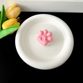 Macro view of cute pink cat paw expandable phone grip with a small heart detail - Transparent Stand / Pink