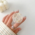 Close-up of a round transparent phone grip filled with colorful sparkling sequins - Holographic Confetti Style (13)