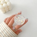 Detail of round glitter phone grip featuring colorful stars and butterfly sequins - Laser Butterfly Star Style (14)