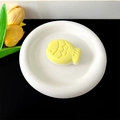 Detail of yellow fish-shaped phone grip on a white ceramic tray with a modern tulip background - Transparent Stand - Two-tone Fish / Yellow