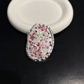 Detail of oval metal phone grip with silver hammered texture and sparkling star sequins - Silver Diamond-like Star Sequins (No. 7)