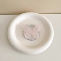 Detailed view of pink lace-style butterfly phone grip on a white ceramic base - Lace Butterfly-Pink