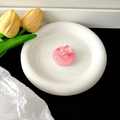 Detailed view of pink glitter bear magnetic phone grip on a white ceramic plate - Transparent Air Cushion Version / Rose Red