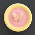 Detailed embroidery texture of pink butterfly phone grip with white pearl accents - Transparent Stand / Orange