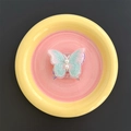 Detail of embroidered butterfly phone grip with soft pastel gradients and pearl accents - Transparent Stand / Green
