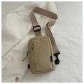 Detail of khaki nylon chest bag with adjustable strap on white textured background - Dark Khaki