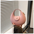 Detail of pink crescent moon PU leather handbag with elegant gold chain and magnetic snap - Pink