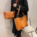Vintage ginger tote bag set with matching pouch shown on shoulder over a black coat - Brown
