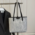 Silver metallic wrinkled tote bag with black handles and large capacity design - Gray
