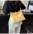 Creamy yellow tote bag with bow detail shown on shoulder for daily casual style - No Pendant / Yellow