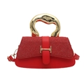 Stylish red glitter handbag featuring a textured finish and bold gold metallic handle - Red
