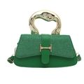Green leather handbag with large gold circular handle and metal H-shaped clasp - Green