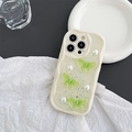 Detailed view of wave-edge phone case with 3D green butterflies and pearl accents - Green Butterfly (Cream Shell - Glitter) / iPhone 7/8/SE 2020