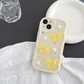 Detail of iPhone case with 3D yellow bows, pearls and wavy cream protective bumper - Yellow Bow (Cream Shell - Glitter) / iPhone 7/8/SE 2020