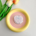Detail of a ceramic heart tray with blue bow accessory and Gift For You sticker - Bow Tie Stripes