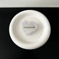 Macro detail of heart-shaped glitter phone grip with purple sparkles on white ceramic tray - Transparent Grip-High Flash Heart Mirror-Purple