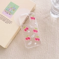 Detail view of iPhone case with 3D cherry, white bowknot, and pearl decorations - Clear Glitter Cherry Bowknot / iPhone 7/8/SE 2020