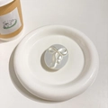 Dettaglio del supporto per telefono a forma di fiocco argento 3D su piatto di ceramica - Fiocco Gift Ovale (Argento) / Argento