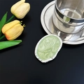 Detail of silver phone grip with green marble texture and irregular hammered edge on black base - High-end Green Oval