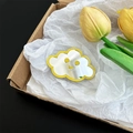 Detailed view of a cute cloud-shaped mirror phone stand with a smiley face design - Yellow