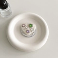 Close-up of heart phone grip with colorful rhinestones on a white ceramic plate - Magnetic Heart Pearlescent Colorful Gem (Green)