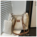 Detail of corduroy tote bag with chain strap and matching small zipper pouch - White