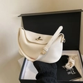 Elegant cream lychee pattern leather pillow handbag with gold buckle and crossbody strap - White