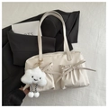 Detail of minimalist beige shoulder bag featuring decorative bows and cute cloud charm - Off-white with Charm