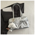 Detail of silver metallic handbag featuring bow-tie pockets and a plush cloud charm - Silver With Pendant