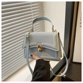 Detail of light blue PU leather handbag with golden ring metal clasp and single handle - Blue