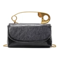 Minimalist black faux leather crossbody bag with distinctive gold safety pin handle - Black