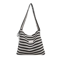 Bolso tote de lona a rayas con lazo de encaje negro y correa ancha sobre fondo blanco - Negro