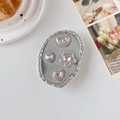 Détail du support de téléphone cœur en strass rose avec élégante base ovale argentée - Support Transparent-Étoile à Quatre Branches-Bord Argenté-Rose