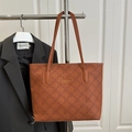 Elegant brown tote bag with embossed flower patterns and minimalist shoulder straps - Brown