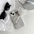 Detail of iPhone case with silver glitter, pearl bow charm, and heart-shaped metal ring - Silver Glitter Pearl Bowknot Pendant / iPhone 7/8/SE 2020