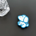 Detail of blue puppy phone grip with a mirror surface and a white pearl eye accent - Blue