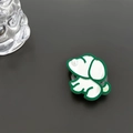 Detail of green acrylic dog phone grip with a mirror surface and pearl eye accent - Green