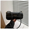 Detail of black rectangular shoulder bag with golden FASHION & BAGS logo and sleek straps - Black
