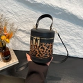 Leopard print cylinder bucket bag with gold zippers and detachable shoulder strap - Black Leopard Print