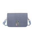Minimalist light blue crossbody bag with denim texture and crystal oval buckle - Blue