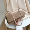 Minimalist beige leather underarm bag with accordion gussets and gold hardware details - Khaki