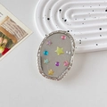 Dettaglio del supporto per telefono ovale con paillettes a stella e cornice argento - Supporto Trasparente-Ovale Glitter-Stella di Diamante Colorata
